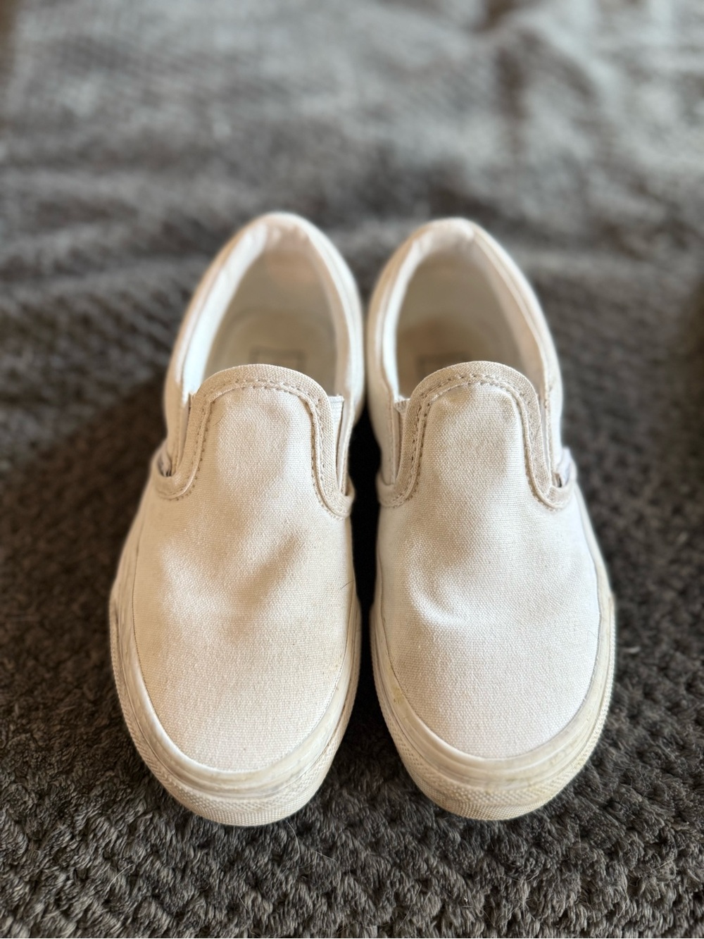 Vans Kids Slip-On Sneakers in Cream